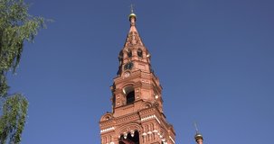 4K summer morning high quality video footage of red brick Gefsimanskiy skit grand cathedral church with golden cupolas in small vintage town Sergiev Posad in Moscow Oblast in central Russia