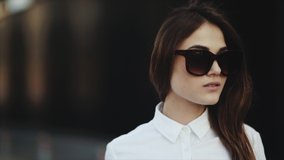 Close up. Business woman with luggage after tiring flight. Portrait of attractive young woman smiling at beach removes sunglasses cool. Attractive blonde young girl with big full lips smiling and - Powered by Shutterstock - Get 15% off with code: PIKWIZARD15