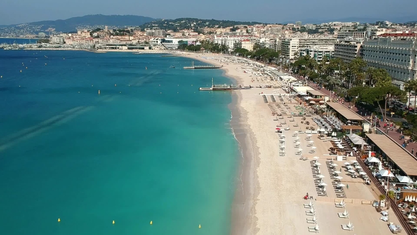 Panorama of Cannes, Cote d'Azur, France, South Europe. Nice city and luxury resort of French riviera. Famous tourist destination with nice beach and Promenade de la Croisette on Mediterranean sea Royalty-Free Stock Footage #1032020051