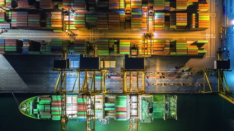 4K Time lapse industrial port with containers from top view or aerial view. It is an import and export cargo port where is a part of shipping dock