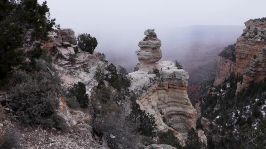 Foggy rock formations in Grand Canyon