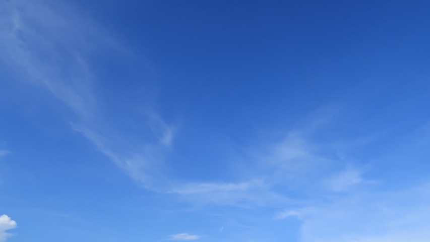 Slowly moving white cirrus cloud turn to angel & wing formation in horizon on tropical summer or spring bright blue wispy sky at sunny day morning sunlight, beautiful relaxing cloudscape TimeLapse  Royalty-Free Stock Footage #1032027281