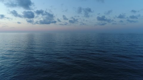 Dark calm sea and sky in the evening. Beautiful sea background, aerial view.