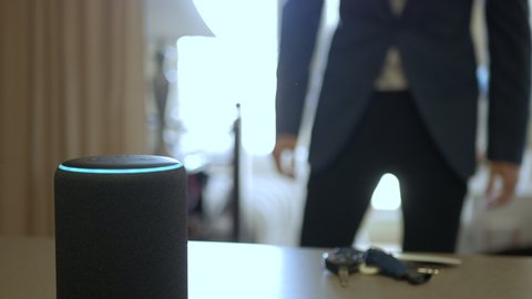Smart Home Device, Man Getting Ready For Work In The Background.