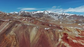 Aerial video from drone  over ?olorful Martian landscape. Geological formation near Kyzyl Chin river on mountain Altai. The tourist name of this territory is Mars. Siberia, Russia. 
