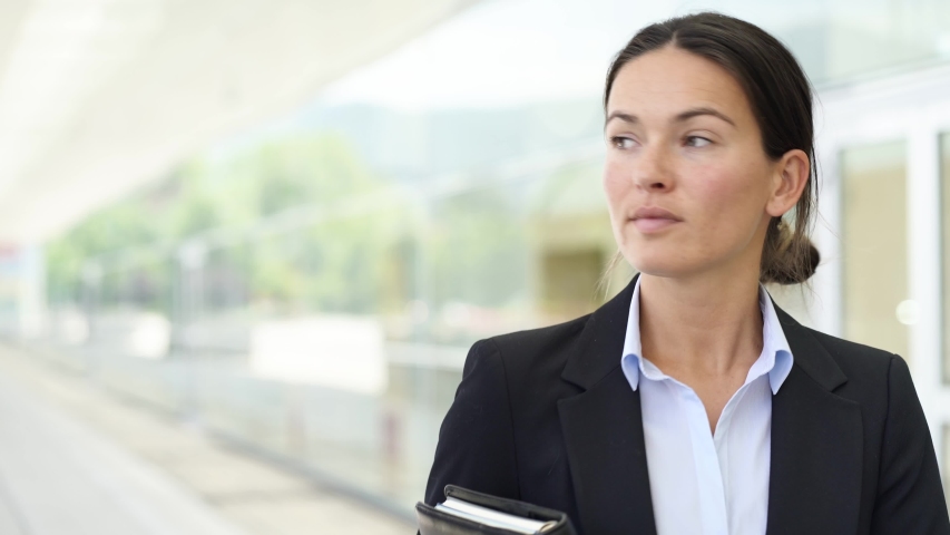 Businesswoman walking outside office building