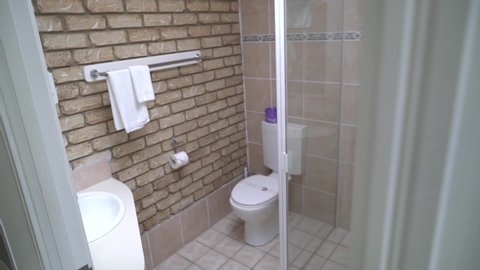 Left side view of bathroom with attached facilities.