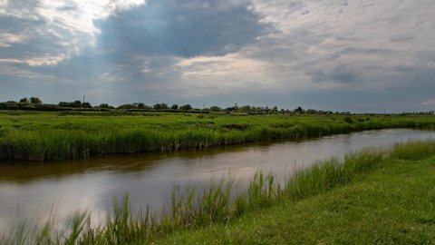 a motion time lapse of clouds and stream at Fairfield Church, romney Marsh, Kent