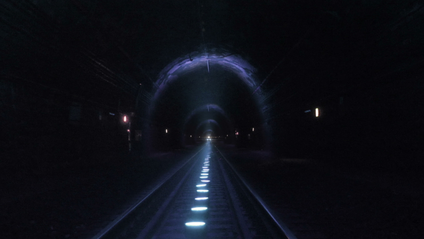 Extreme train coming towards camera in a railway tunnel. Representing achieving your goals, getting through problems and obstacles or problems seem bigger than they really are Royalty-Free Stock Footage #1032073466