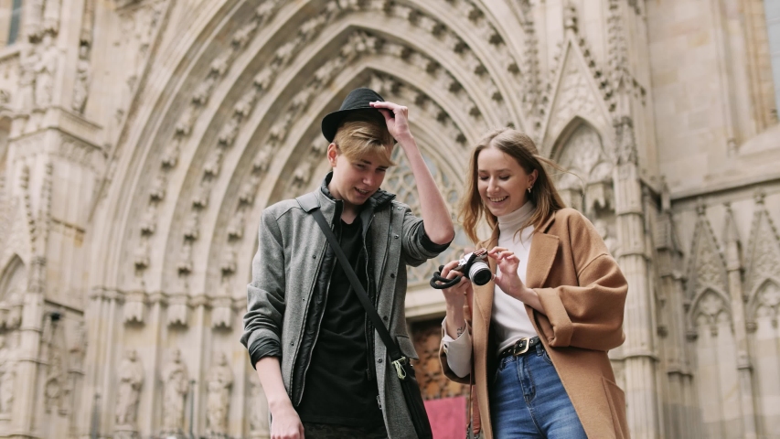 Pretty girl making a foto during talk with her friend