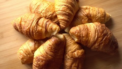 Many Croissants on Wood Table 