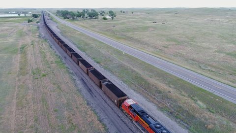 Antioch, NE, USA - July 6, 2017: Aerial view of a long BNSF coal trail running east through Nebraska Sandhills
