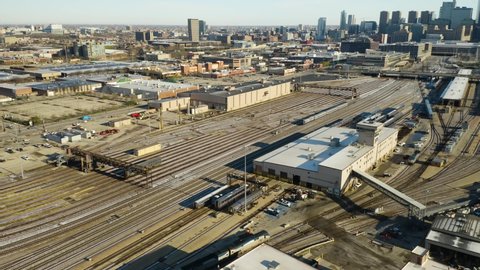 Chicago, Illinois / USA - June 1, 2019: Cinematic Tracking of Amtrak Metro Train in Chicago railyard [4K]