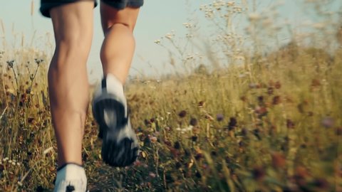 Runner Cardio Exercising Outdoor. Marathon Running sport Triathlon Competition.Trail Runner Jog Workout.Man Athlete Legs Jogging Sport Recreation. Sprint Endurance Training On Trail.Healthy Lifestyle.