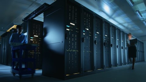Time Lapse in Data Center: IT Specialists and Engineers Working, Running Maintenance Check, Diagnostics.  Telecommunications, Cloud Computing, Artificial Intelligence, Database, Supercomputer