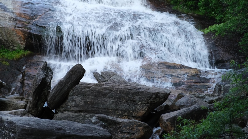 The cascades of the Lower Falls in Graveyard Fields, a very popular waterfall and hiking destination near Asheville, North Carolina in the Blue Ridge Mountains off the Blue Ridge Parkway.