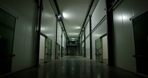 big freezer warehouse at the plant. facade with industrial freezer warehouse door. Wide shot.