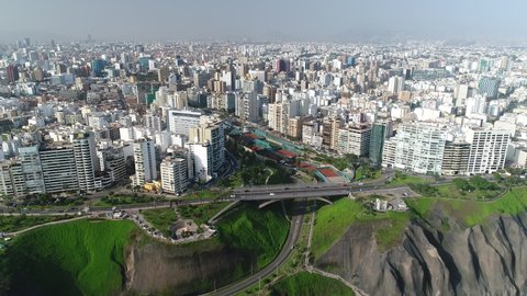 Pullback view of Miraflores and riseup to show Lima city, in Peru.