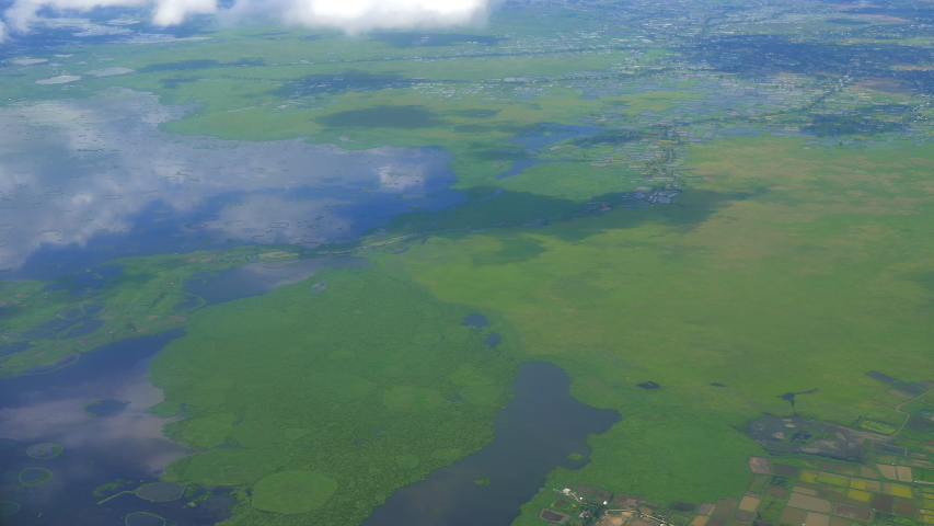 View of Imphal, surrounding area and Loktak lake in slow motion from plane window, Manipur,India.