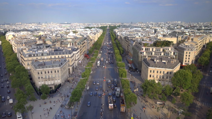 Paris skyline with the Champs Elysees Avenue seen from the roof of the Arc de Triomphe on a beautiful Spring day Royalty-Free Stock Footage #1032154364