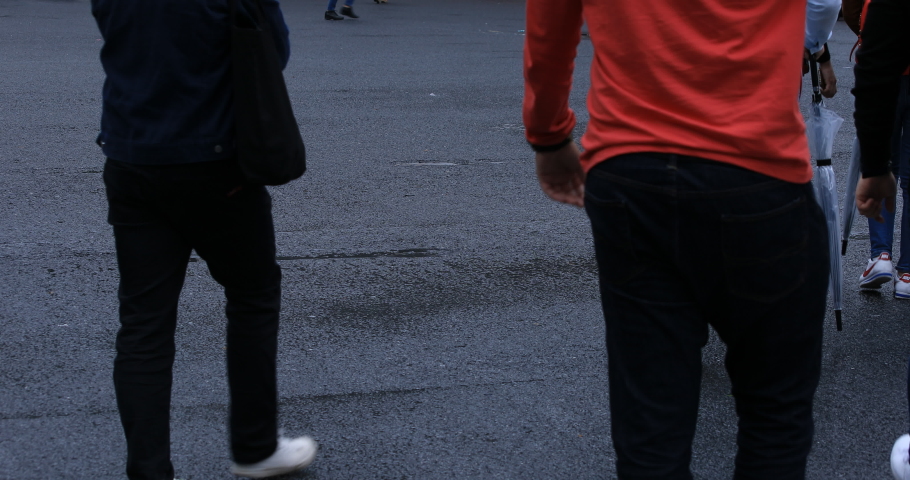 Legs of walking people at the crossing rainy day. Shibuya district Tokyo Japan - 04.30.2019 : It is a center of the city in tokyo. camera : Canon EOS 5D mark4