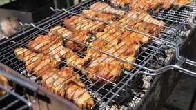 Chicken marinated juicy natural dietary Legs on the Grill. BBQ party for a big company.