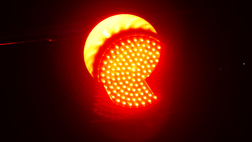 Signal of Red traffic light in night in motion view | Shutterstock HD Video #1032182609