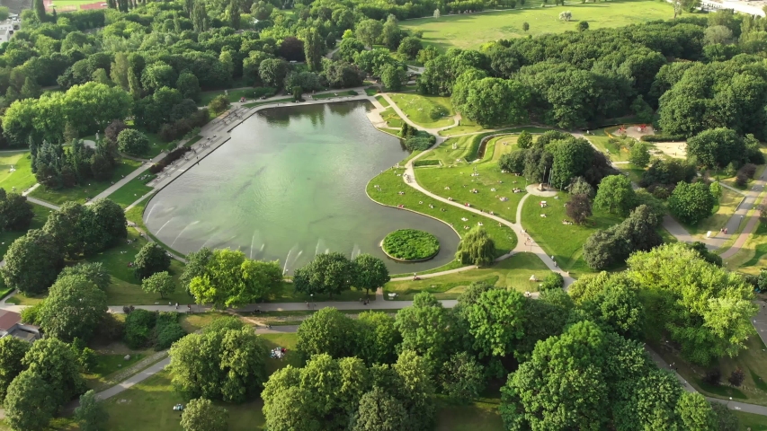 Pole Mokotowskie Warsaw Park field with lake and city aerial view Royalty-Free Stock Footage #1032187493