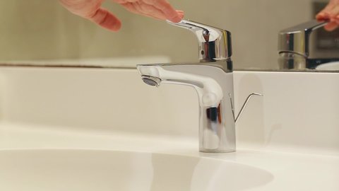 faucet bathroom running water man keeps Stock Footage Video (100% ...