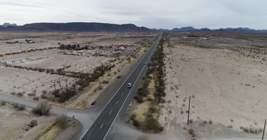 Southern Arizona sandy ladscape with cyclist and cars on road