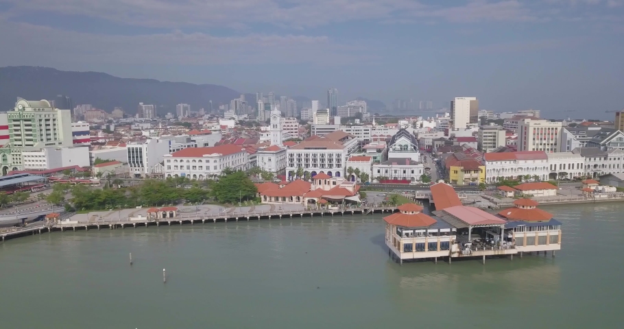 Aerial view of George Town, Clan Jetties, and boats along the waterfront of George Town, Penang, Malaysia, represents a unique settlement by Chinese immigrants with boats during morning.