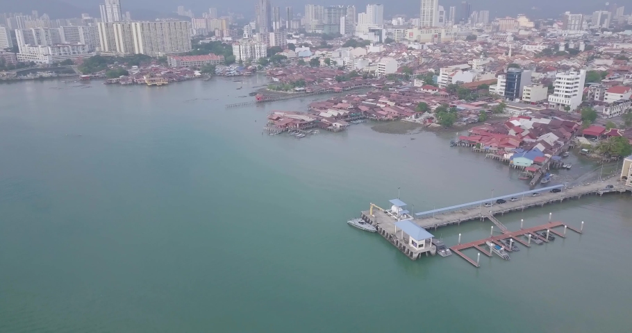 Aerial view of George Town, Clan Jetties, and boats along the waterfront of George Town, Penang, Malaysia, represents a unique settlement by Chinese immigrants with boats during morning.