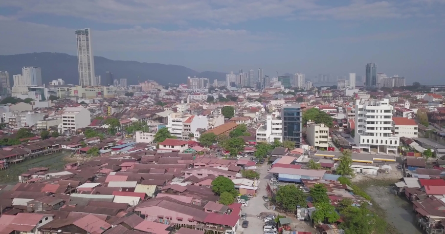 Aerial view of George Town, Clan Jetties, and boats along the waterfront of George Town, Penang, Malaysia, represents a unique settlement by Chinese immigrants with boats during morning.