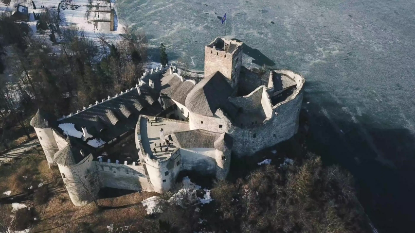 Castle on the lake in Niedzica, Poland. Winter and snow