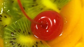 Closeup macro view of sweet food. Top view of colorful fruit jelly rotating.