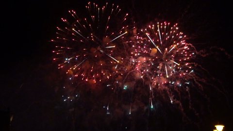 Beautiful colourful fireworks at night in slow-mo