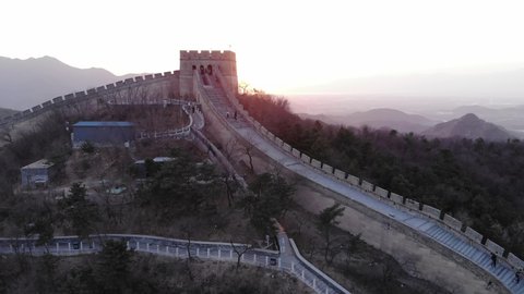 Watchtower building at Badaling Great Wall of China, aerial shot at sunset hour. Popular touristic attraction, well maintained reconstructed section of famous historical landmark at China