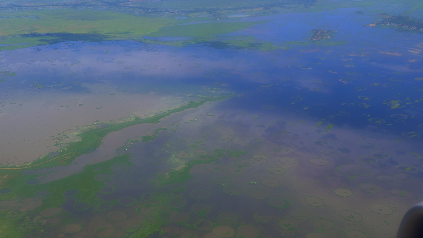 View of Imphal, surrounding area and Lok Tak lake in slow motion from plane window, Manipur,India.