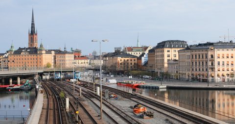 STOCKHOLM, SWEDEN - MAY 1, 2019: Metro trains on the bridge against Gamla Stan, the Stockholm Old City. Opened in 1950, the Stockholm Underground is the only subway system in Sweden