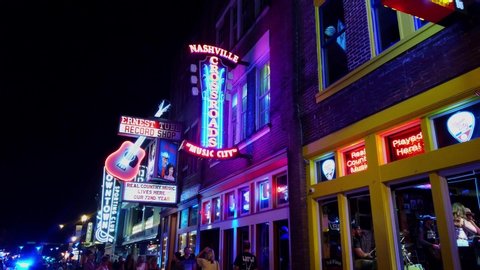 Walking over Broadway in Nashville by night - NASHVILLE, TENNESSEE - JUNE 16, 2019