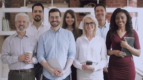Serious happy professional business team video portrait, young and old diverse leaders employees posing together standing in office, multiracial staff corporate people workers group looking at camera - Powered by Shutterstock - Get 15% off with code: PIKWIZARD15