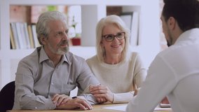 Happy older family couple clients make sale purchase deal sign insurance contract handshake estate agent lawyer, satisfied senior customers and bank manager shake hands buy new house at meeting - Powered by Shutterstock - Get 15% off with code: PIKWIZARD15