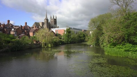 Royal Leamington Spa, the Parish Church viewed across the river Leam on a tranquil summers day, Warickshire, England