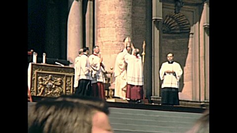 VATICAN CITY, ROME, ITALY - CIRCA 1970: old Pope Saint Paul VI reading sacred scriptures during the mass in Saint Peter square of Rome. Historical Archival of Rome capital of Italy in the 1970s.