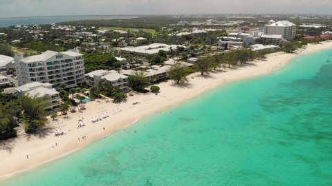 Grand Cayman - Beautiful famous Seven Mile beach Aerial shot of beautiful famous Seven Mile beach at Grand Cayman Caribbean island with clear turquoise water 