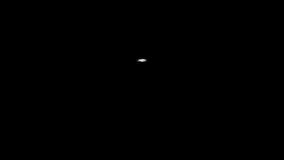 The image is of a black background with a white, glowing, conical shape in the center.