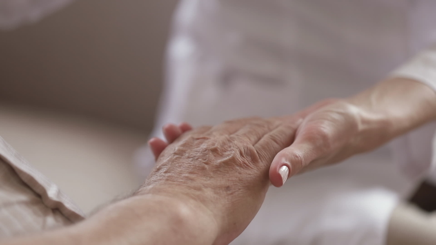 Young kind woman nurse daughter caregiver holding stroking hand of old elder man patient close up view, senior grandparent care, two generations support concept, grandparent healthcare and hope Royalty-Free Stock Footage #1032303731