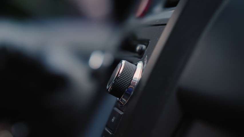 Male hand adjusts the tuning of the car radio Royalty-Free Stock Footage #1032317486