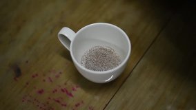 Pouring hot water into coffee cup