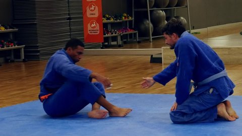 Lisbon, Portugal - June 29, 2019: Two men practice Brazilian Jiu-Jitsu sparring, a grappling type martial arts with a kimono gi - NOT STAGED CONTENT